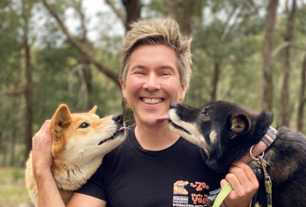 Chris with Dingoes by Taasha Humfrey